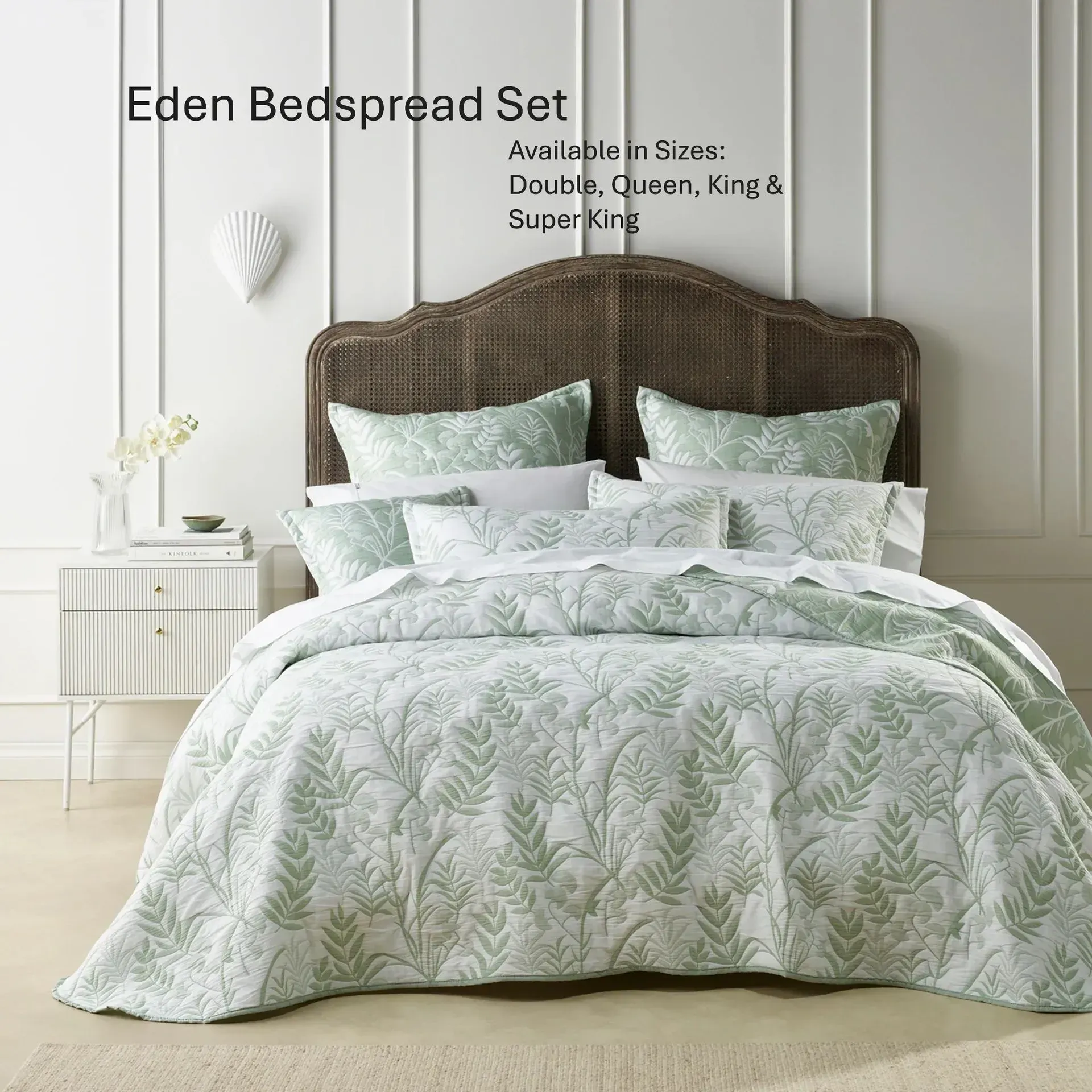 Mint green quilted bedspread on a bed with rustic wooden headboard in a bright bedroom