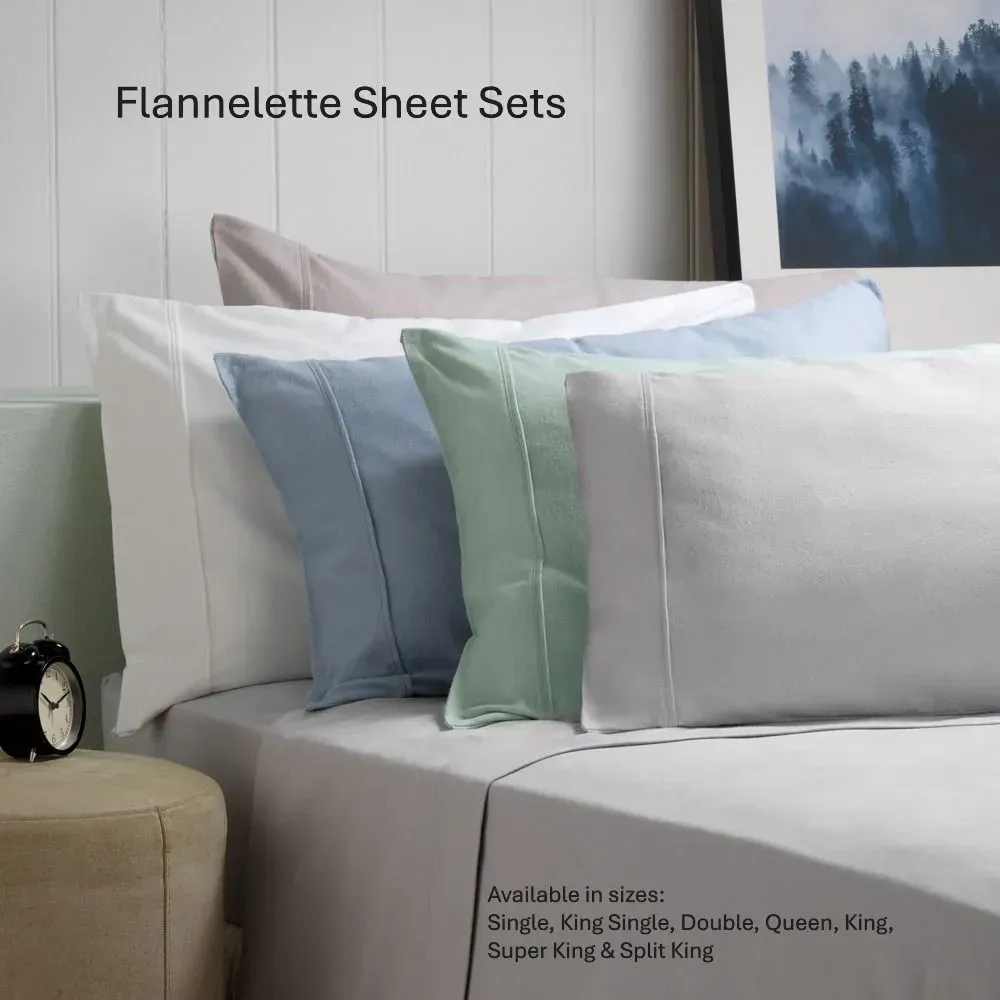 Flannelette sheet sets in white, blue, and mint on a neatly made bed