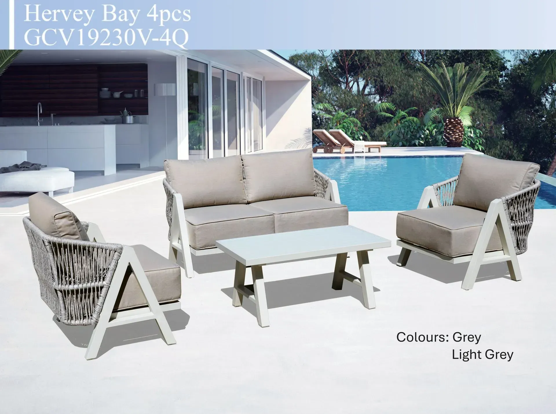 Gray wicker patio lounge set with sofa, chairs, and coffee table by a poolside in a modern backyard