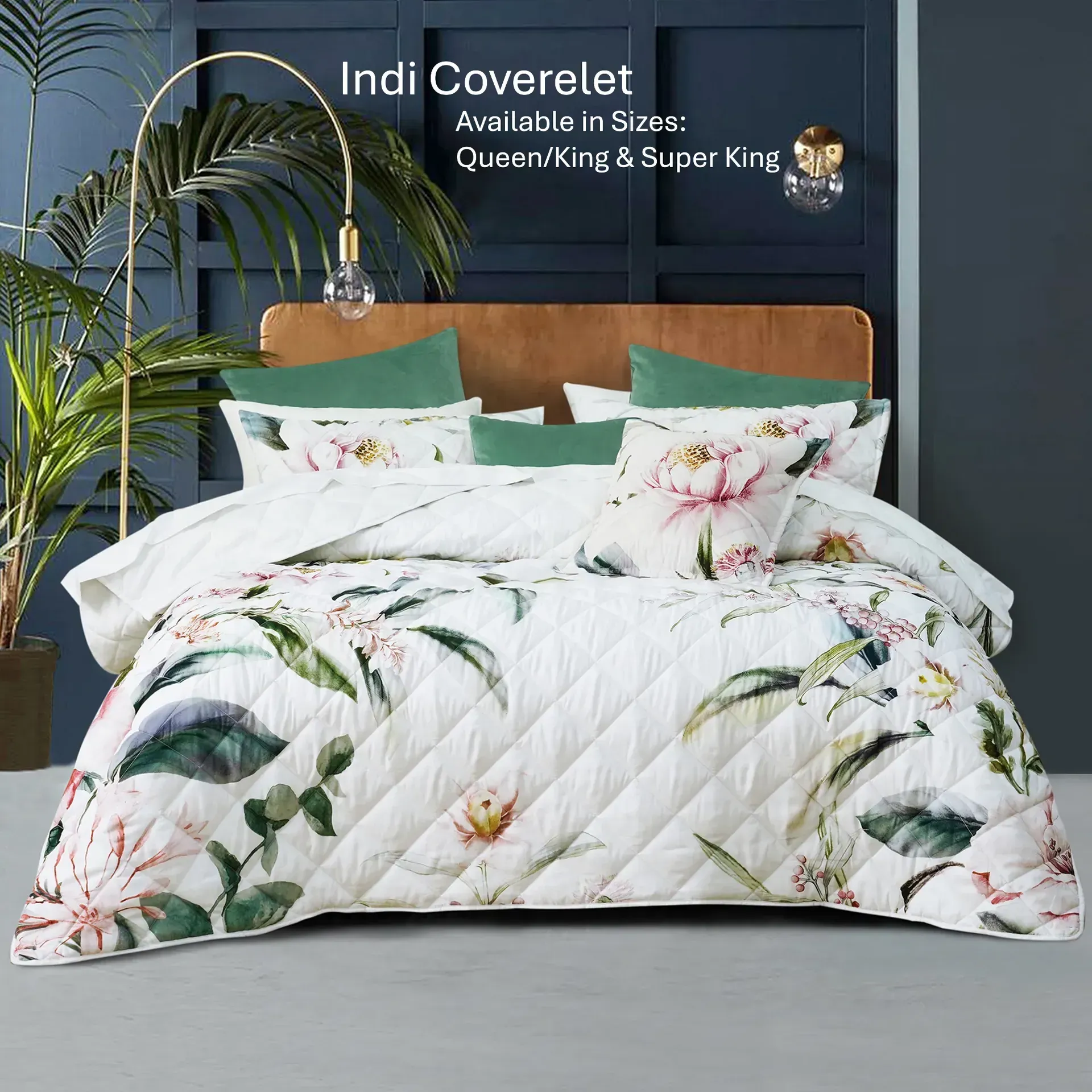 Floral quilted coverlet on a bed with brown headboard and white pillows against a dark wall.