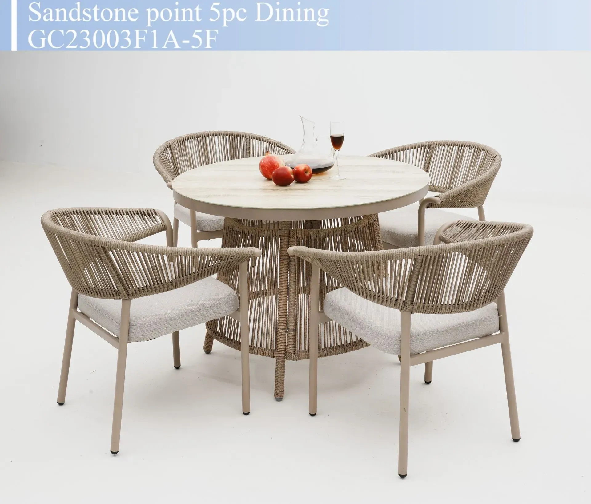 Round wicker dining set with four chairs and a light wood table, beige and white on a white background