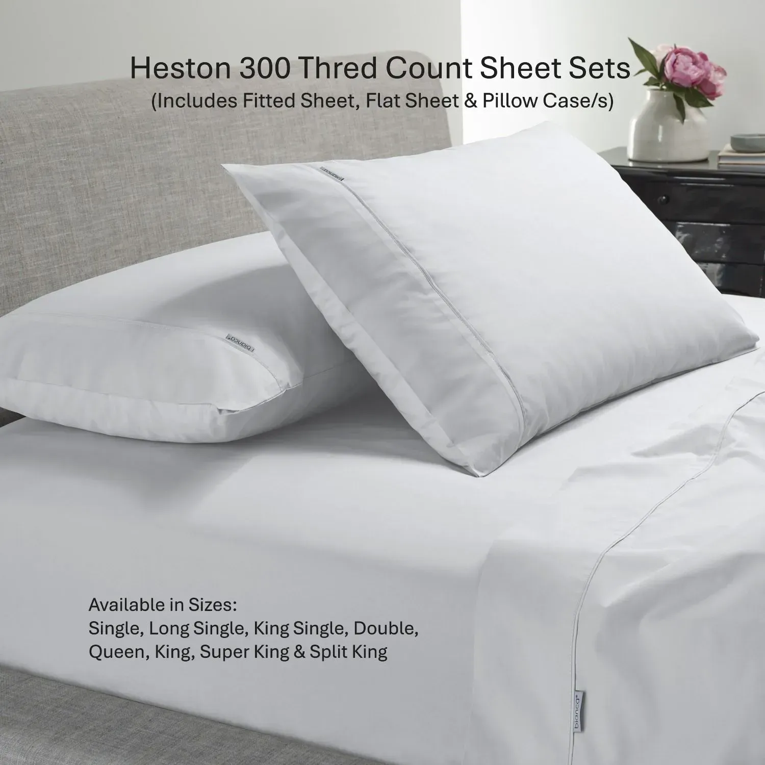 White Heston 300 thread count sheet set on bed with pillowcases in a bright bedroom scene