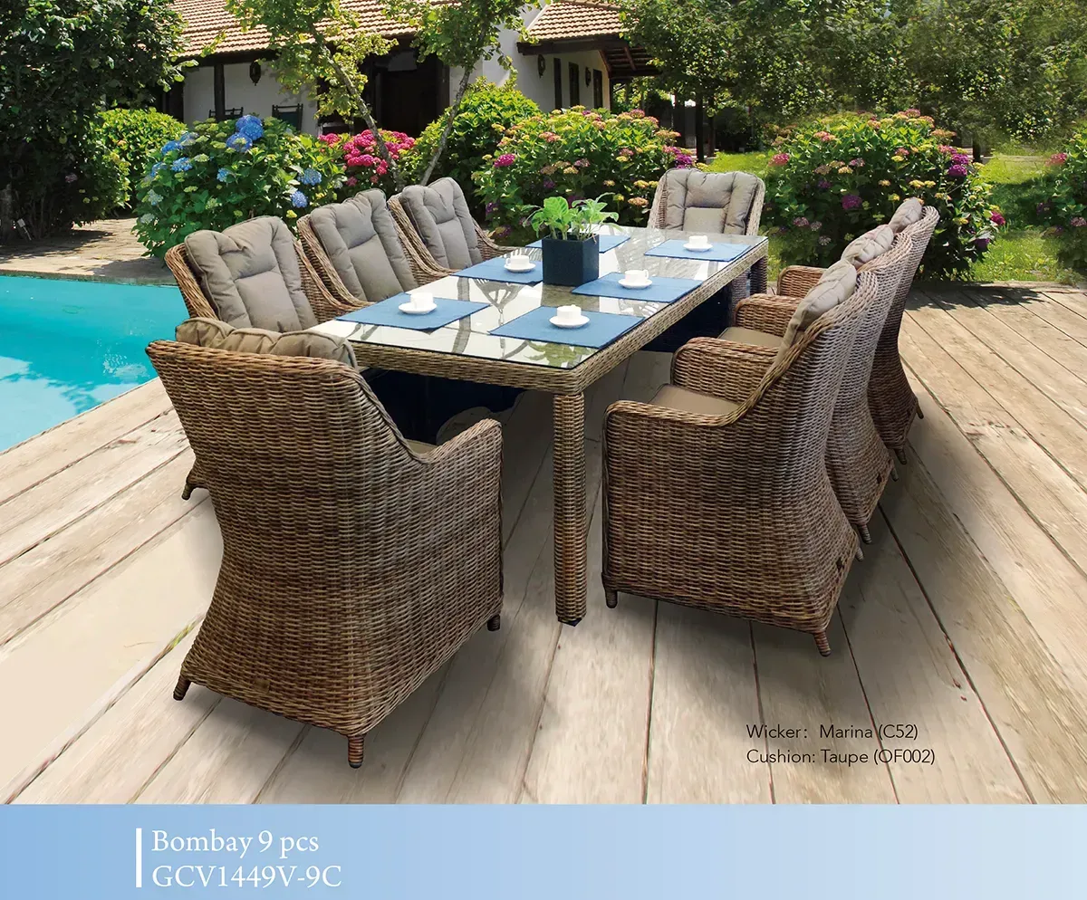 Wicker dining set with blue chairs on a wooden deck in a garden