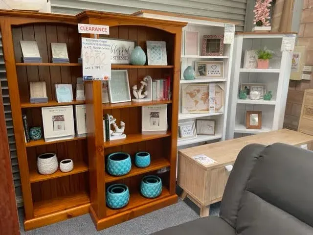 Display of decorative shelves with ceramics and baskets in a furniture showroom