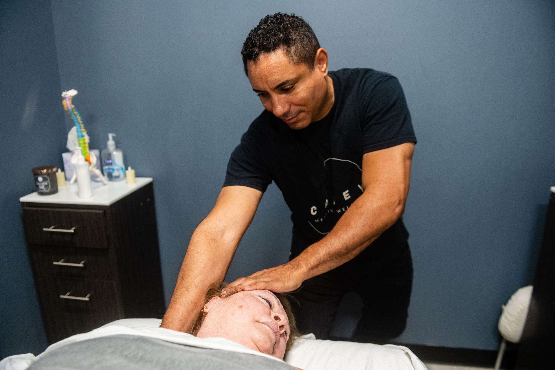 mel casey lmt performing stretching at casey healing wellness