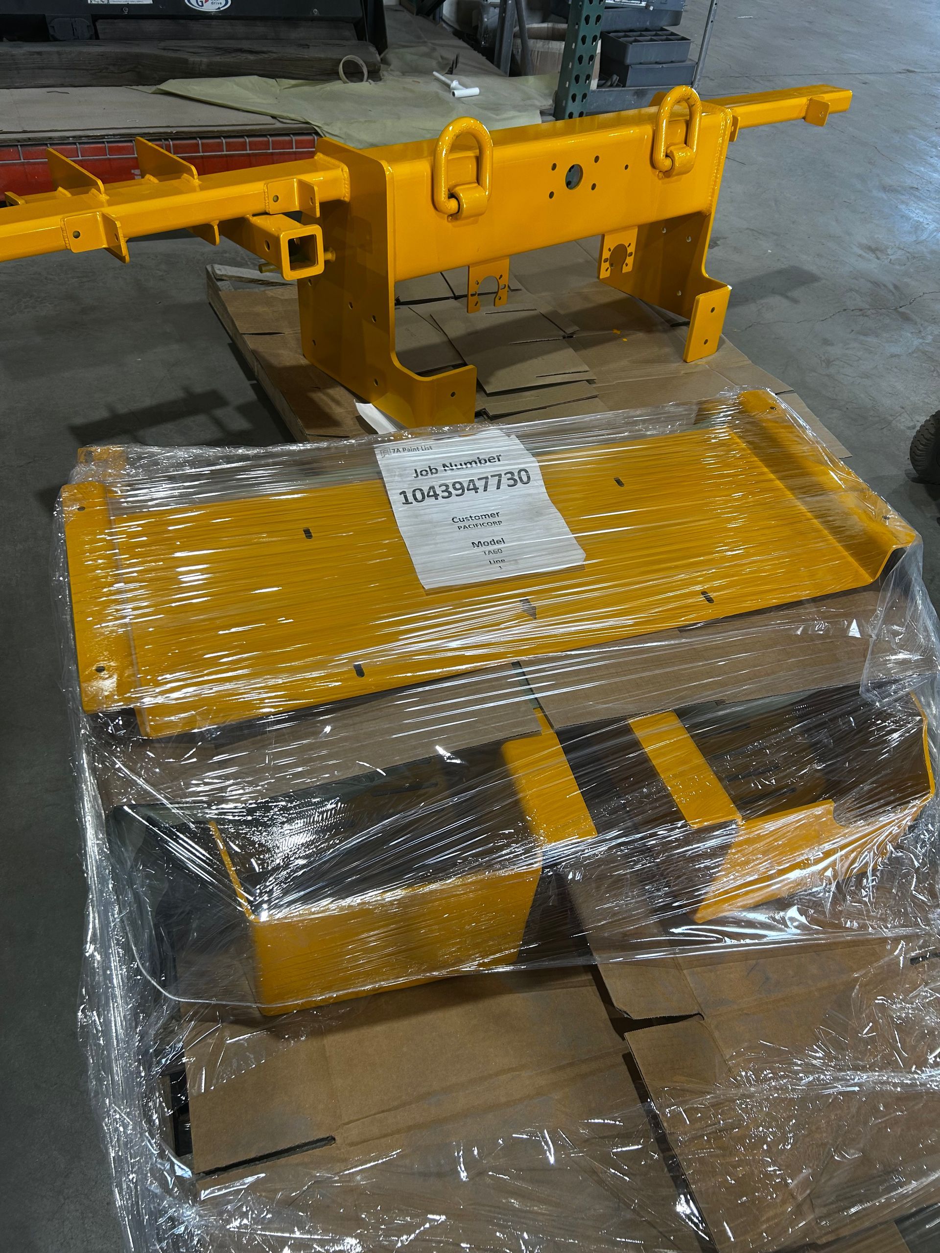 A finished fabricated component, wrapped and ready for pickup.