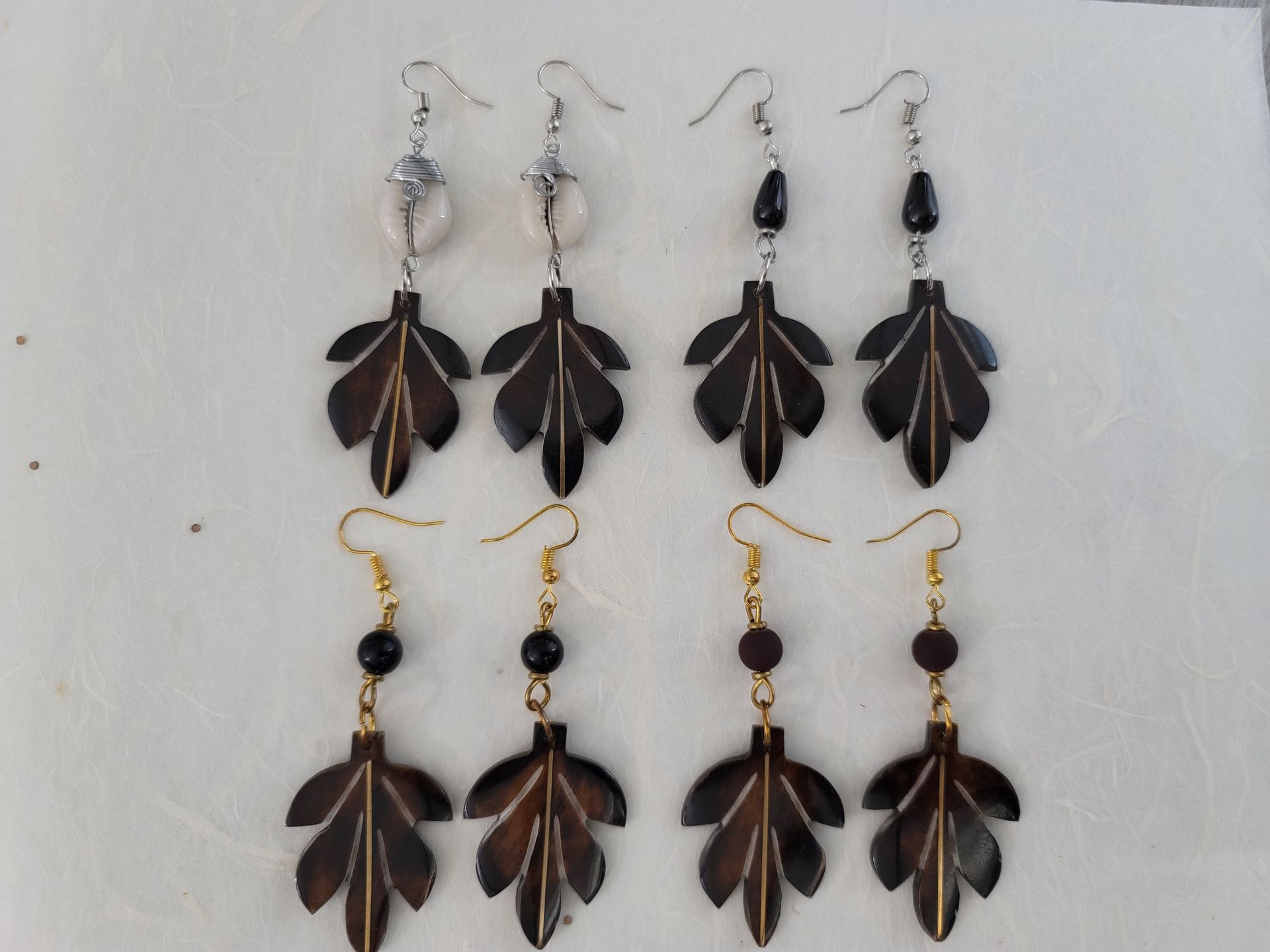 Ankole cow horn earrings, handmade bone earrings, ethical jewelry, African-inspired jewelry, artisan-crafted earrings, sustainable fashion accessories.