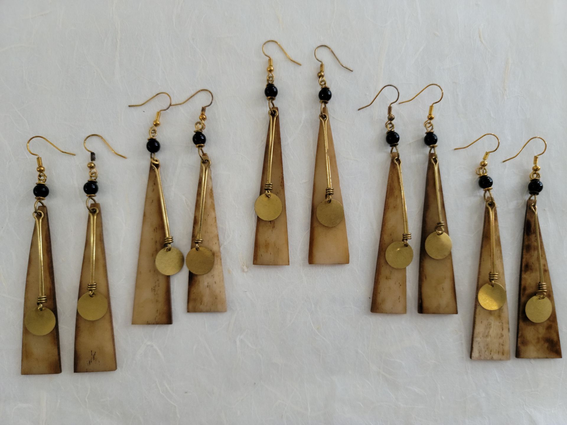 Tas Tas Ankole horn drop earrings with elongated natural horn pieces and metallic accents
