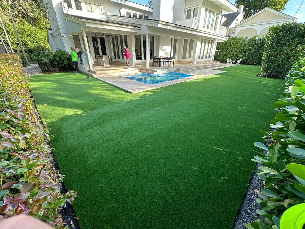 There is a swimming pool in the backyard of a house.