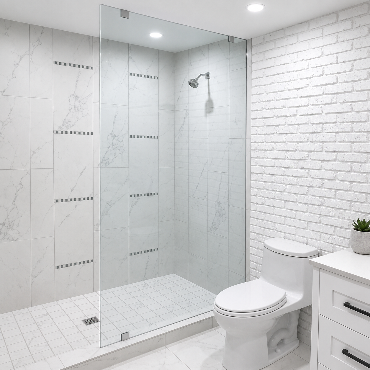 Modern bathroom with glass shower, white tile walls, toilet, and vanity sink