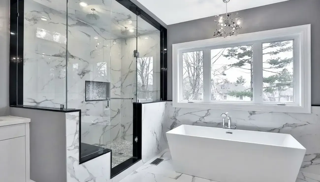 Modern white bathroom with glass shower, freestanding tub, and large window.