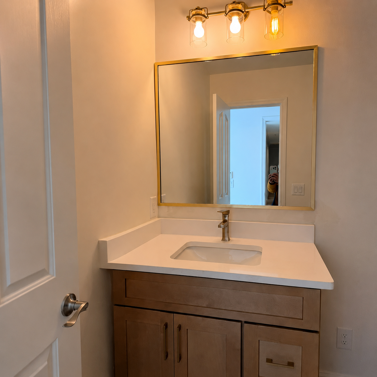 Bright marble bathroom with glass shower, freestanding tub, and large window