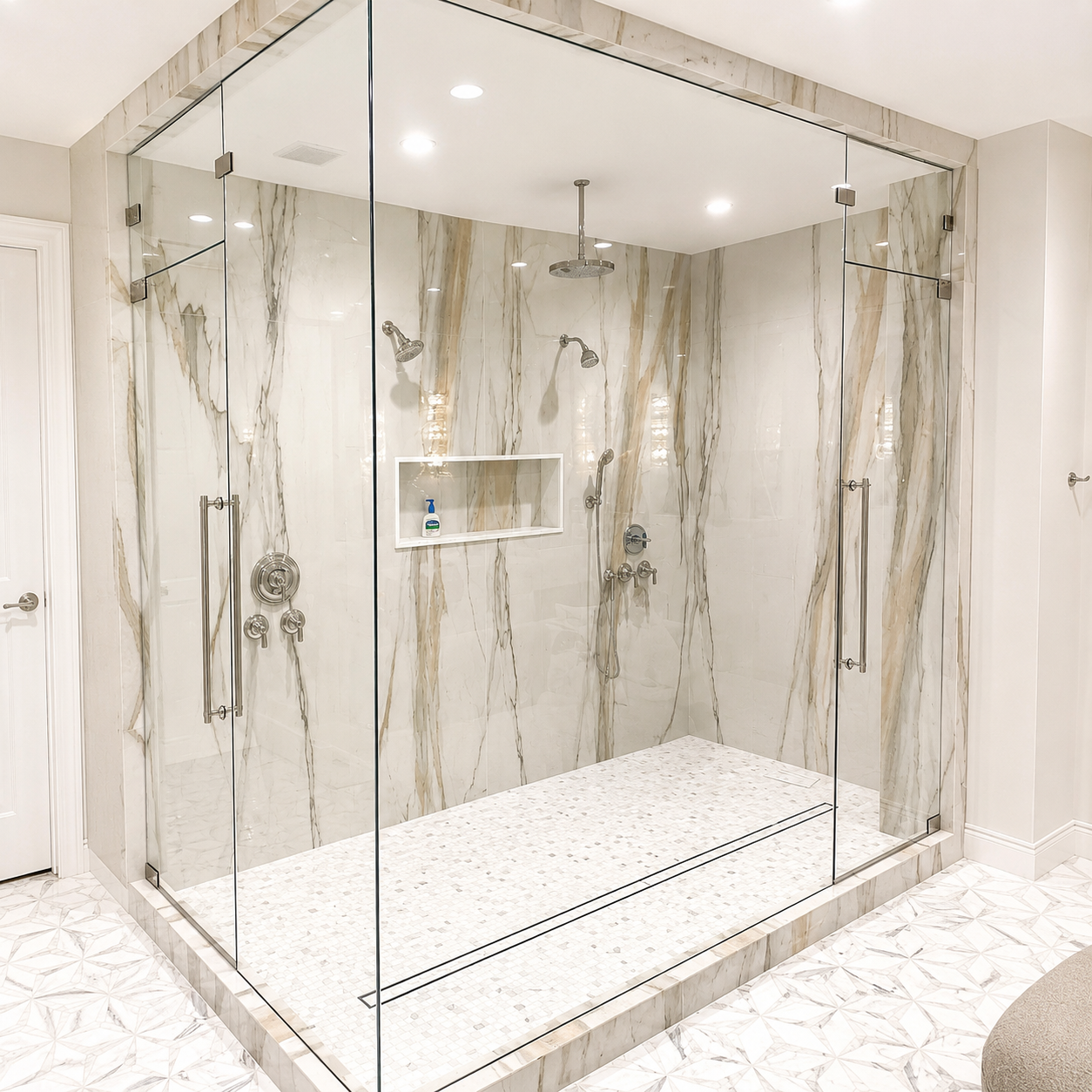 Bright marble bathroom with glass shower, freestanding tub, and large window