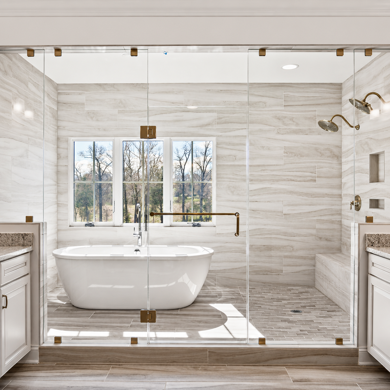 Bright marble bathroom with glass shower, freestanding tub, and large window