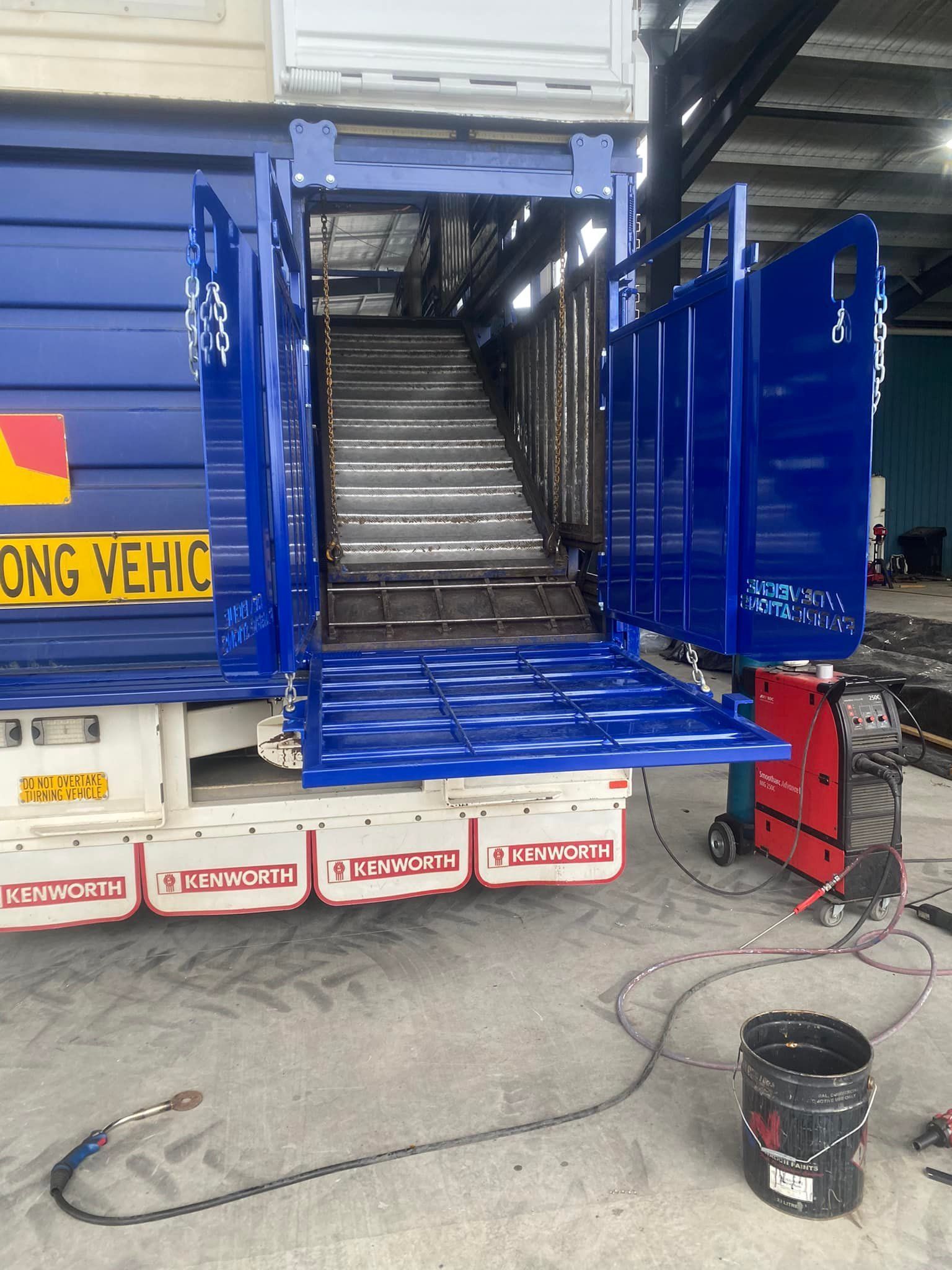 A Blue Truck With the stock grate door opened— Deveigne Fabrications In Brocklehurst, NSW