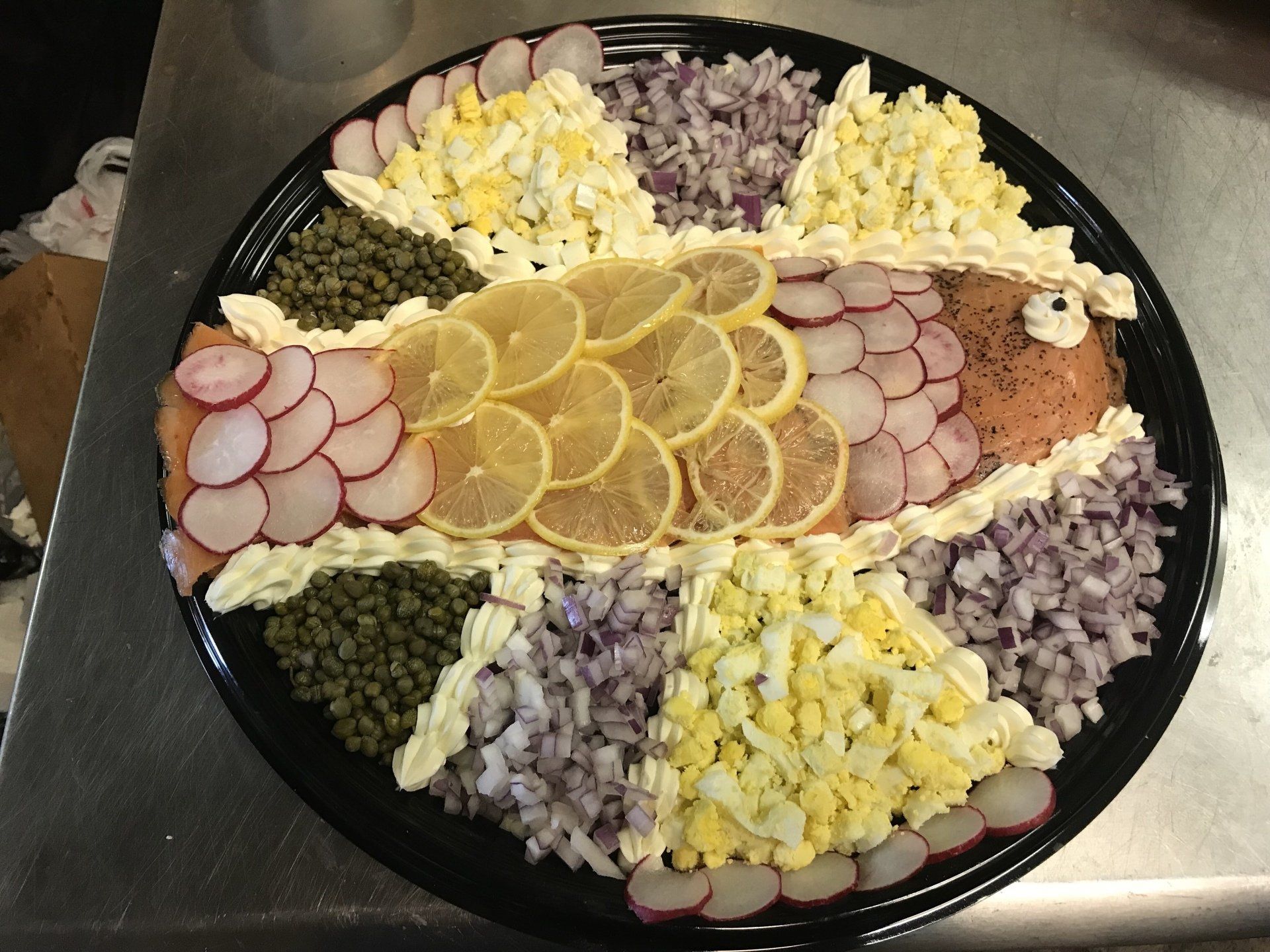 A tray of food that looks like a fish on a table