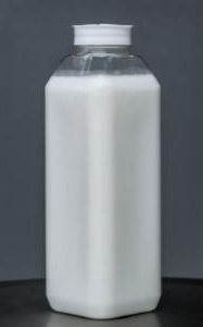 White plastic bottle with a white screw cap on a gray surface.