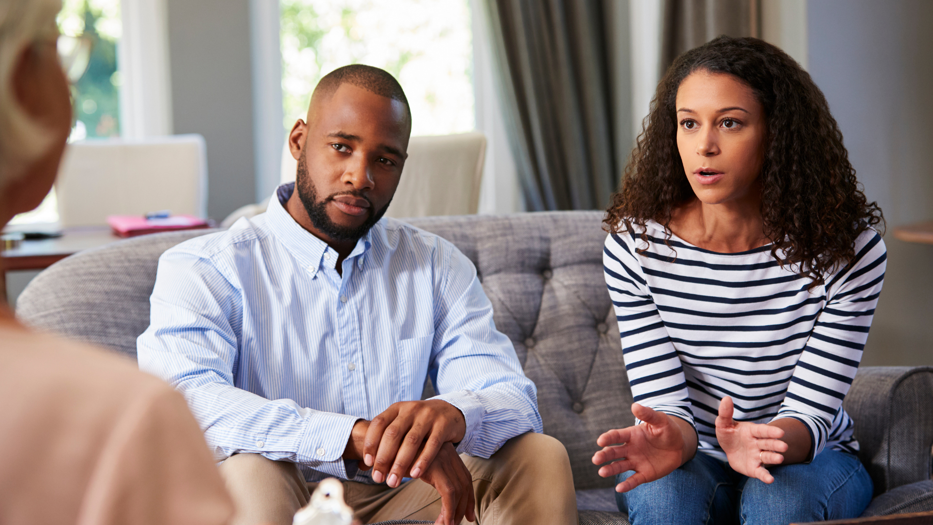 A couple seeking couples counseling with a therapist