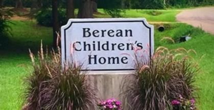 Sign for Berean Children’s Home in a landscaped garden setting