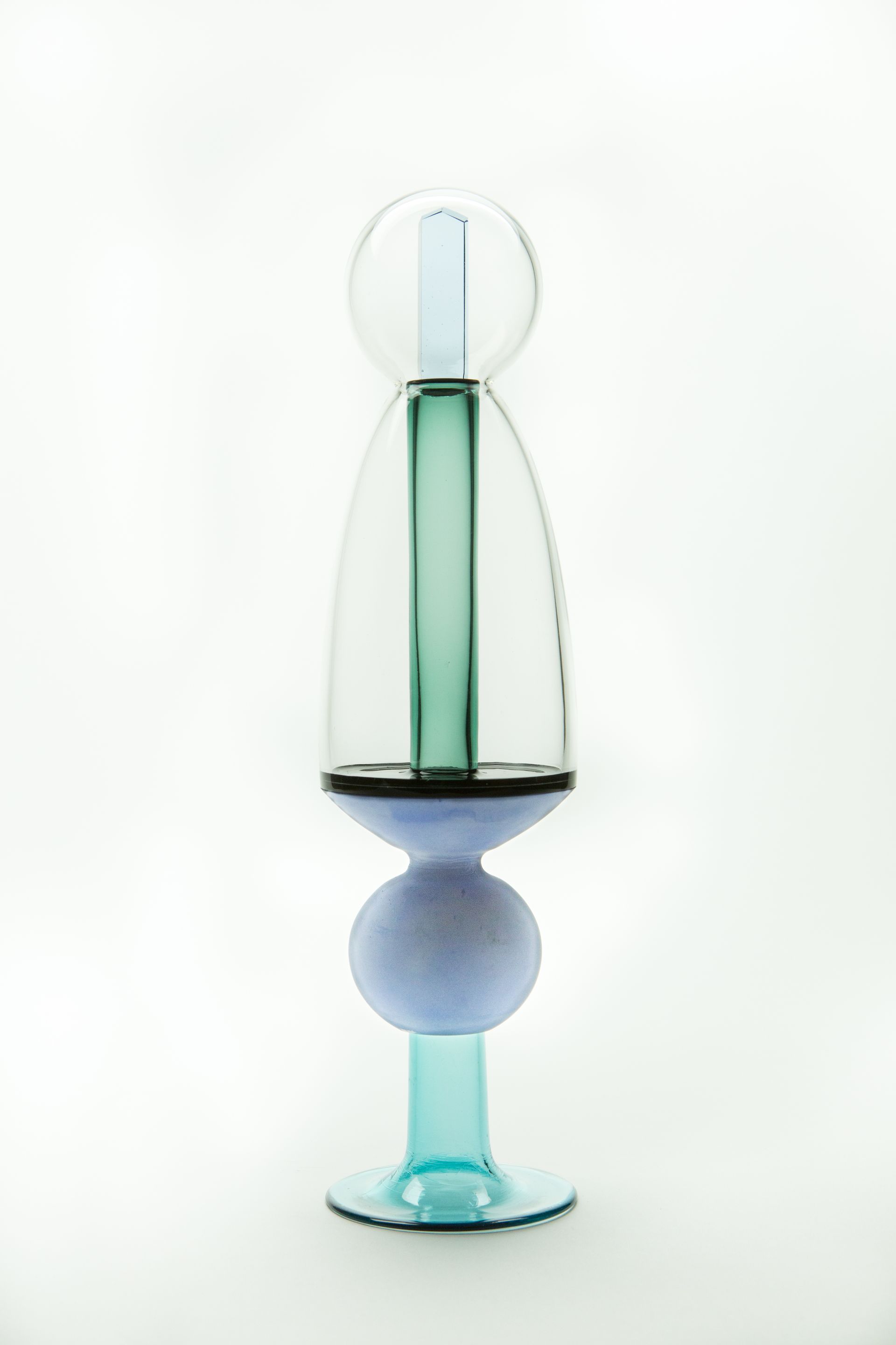 Abstract glass sculpture, blue and teal, with a spherical top, a tall central column, and a round base.