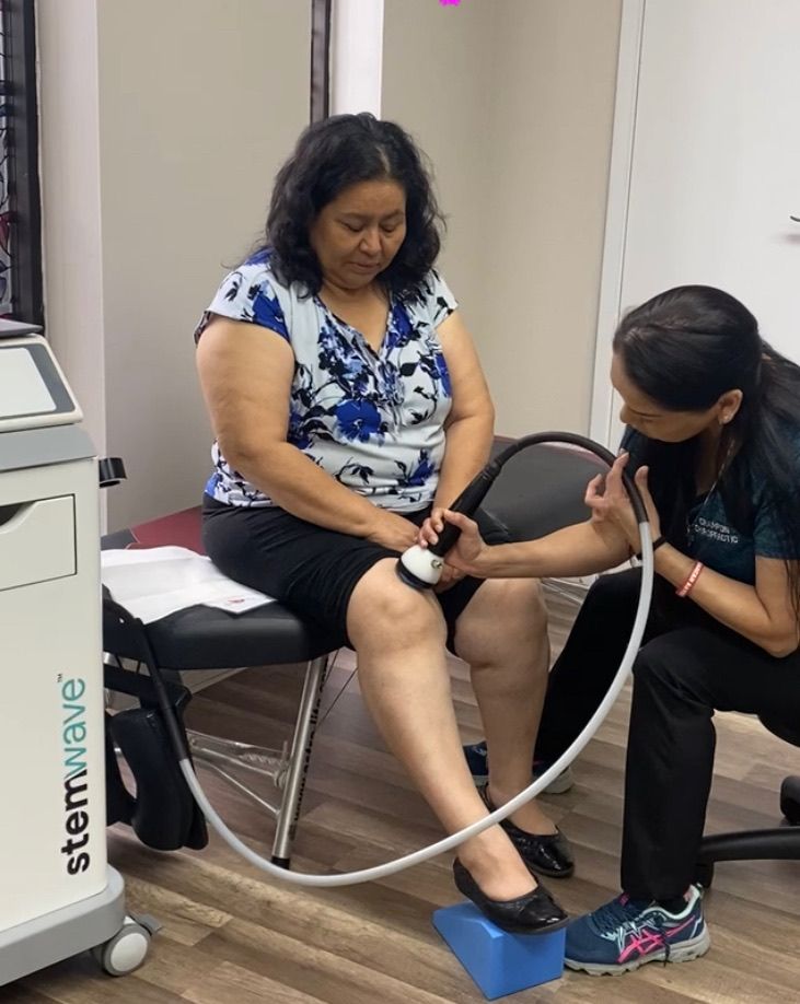 Patient receives gentle neck assessment at Champion Chiropractic of Pasadena in Pasadena, Texas.