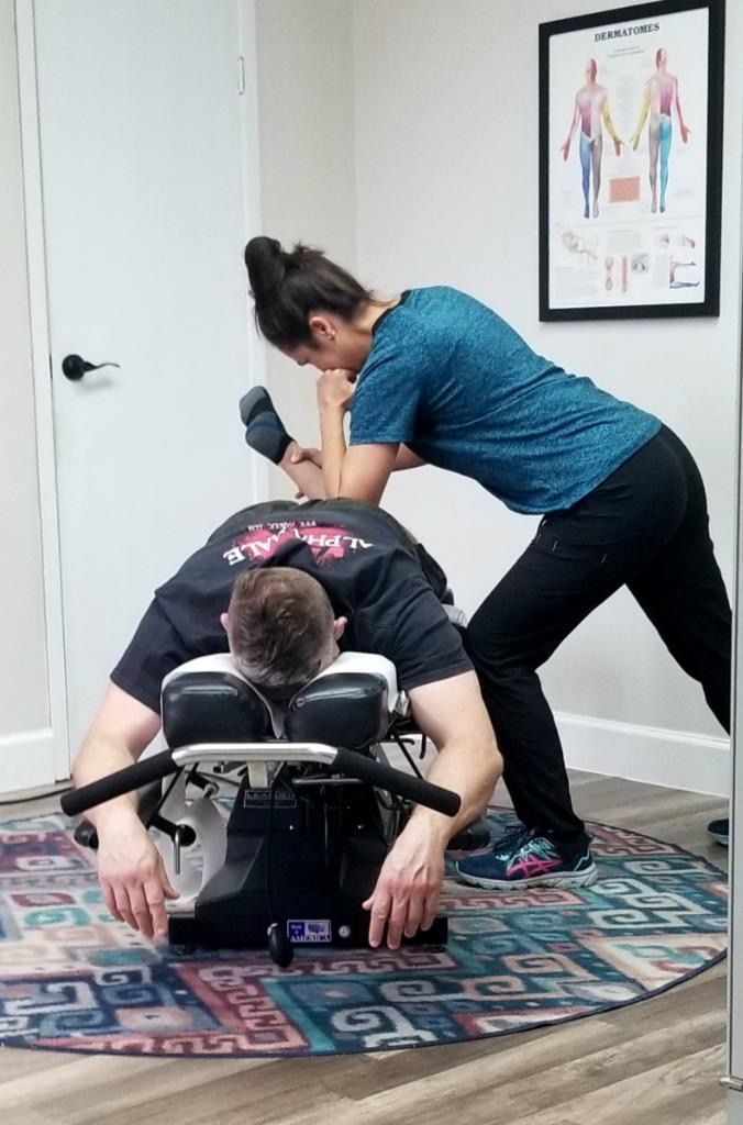 Posture assessment in progress at Champion Chiropractic of Pasadena in Pasadena, Texas.