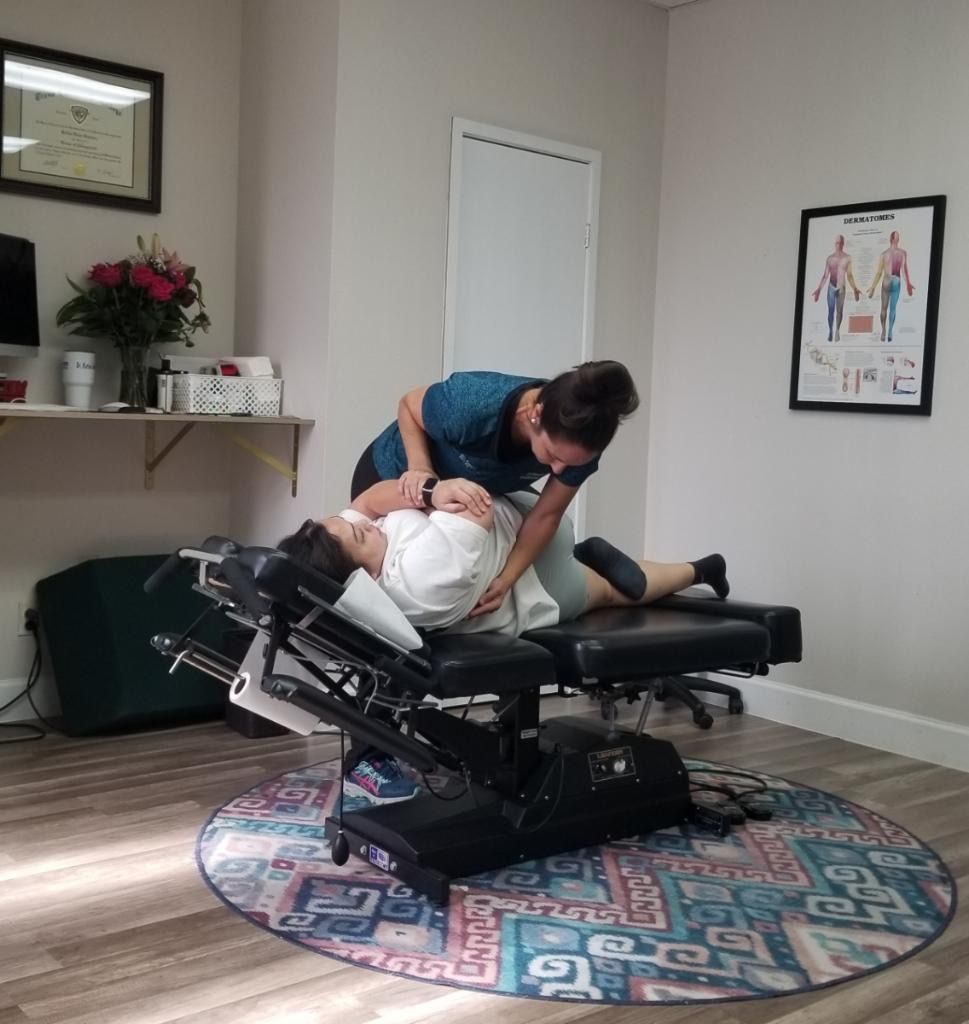Patient receiving a gentle spinal adjustment at Champion Chiropractic of Pasadena in Pasadena, Texas