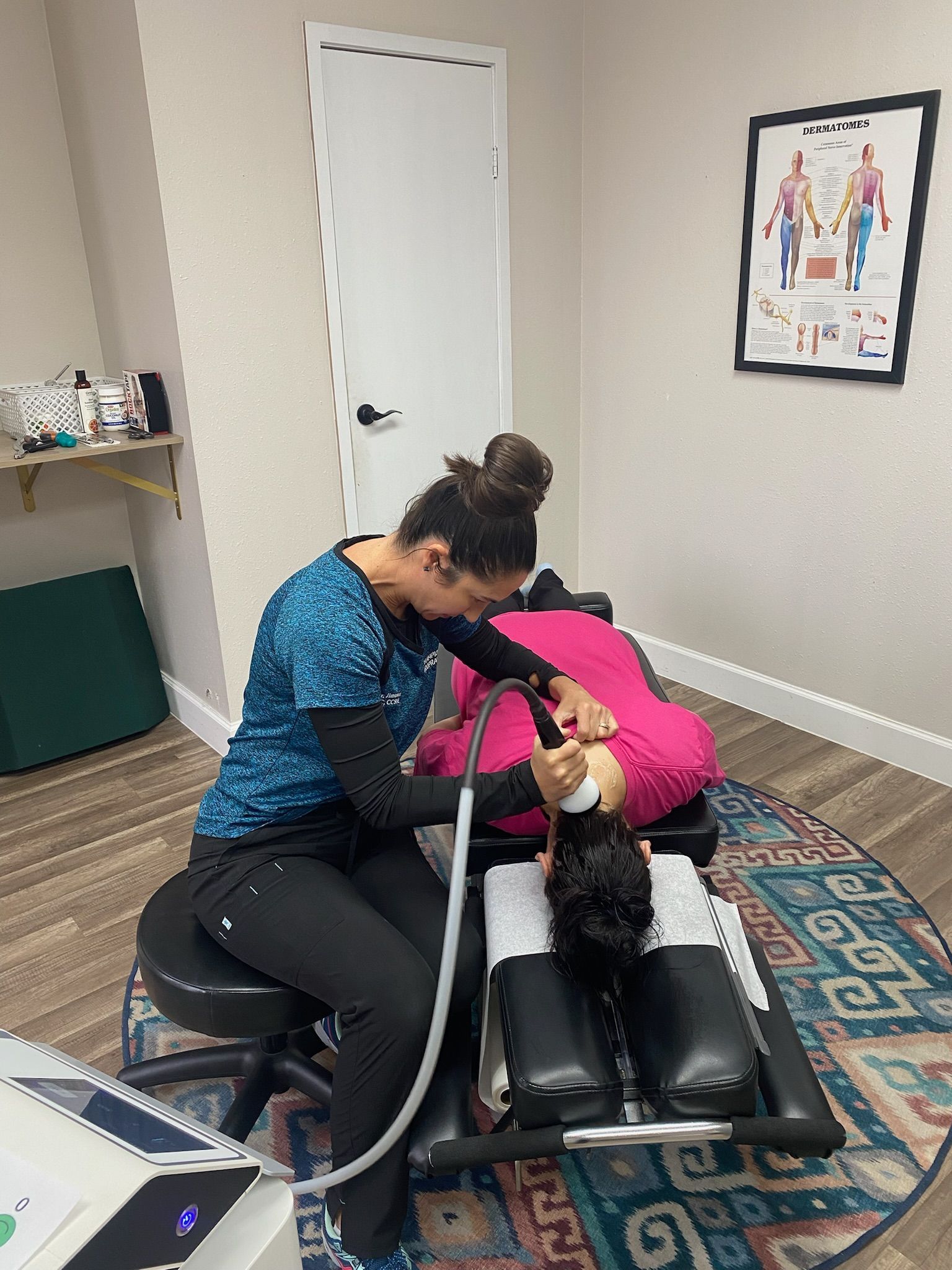 Patient receiving gentle neck adjustment at Champion Chiropractic of Pasadena in Pasadena, TX.