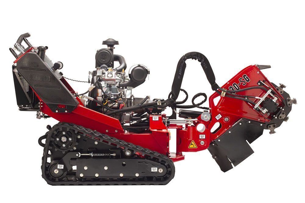 A red and black stump grinder with a engine on a white background.
