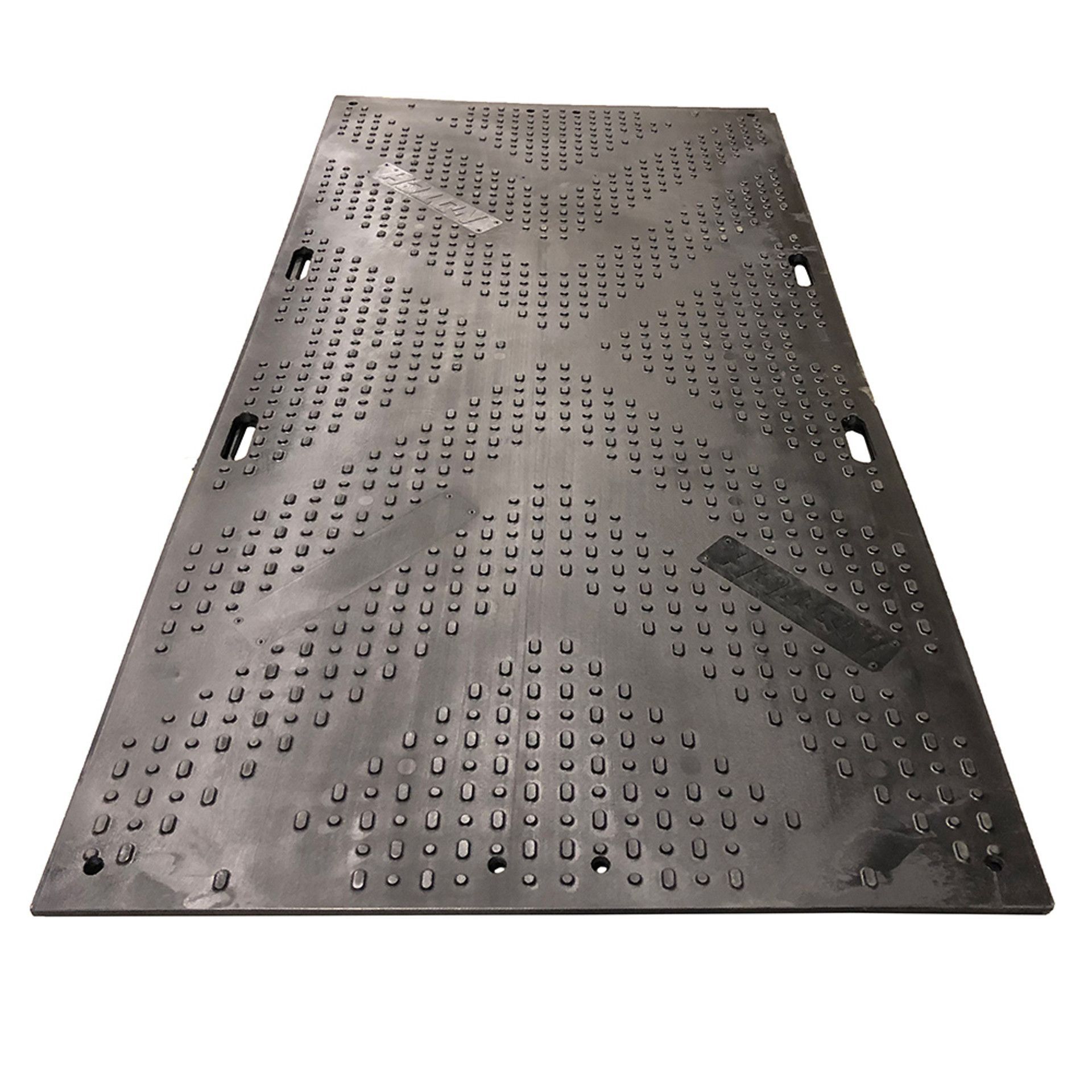 A black rubber mat with holes in it on a white background