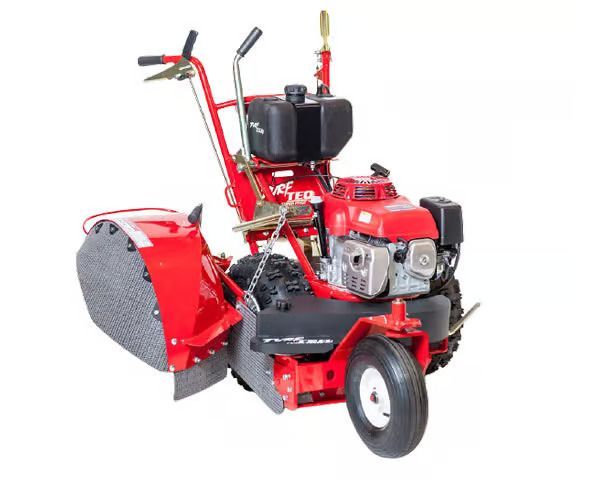 A red lawn mower with a brush attached to it on a white background.