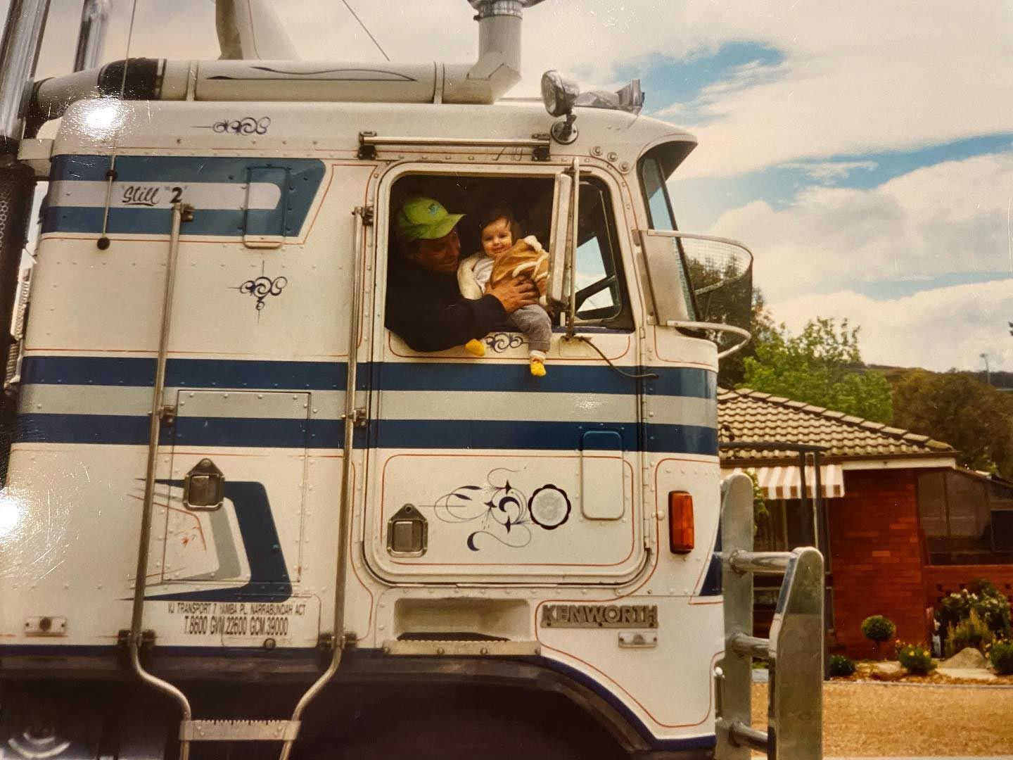 Truck Driver Holding His Son by the Truck Window — Joe Camilleri Transport in Fyshwick, ACT