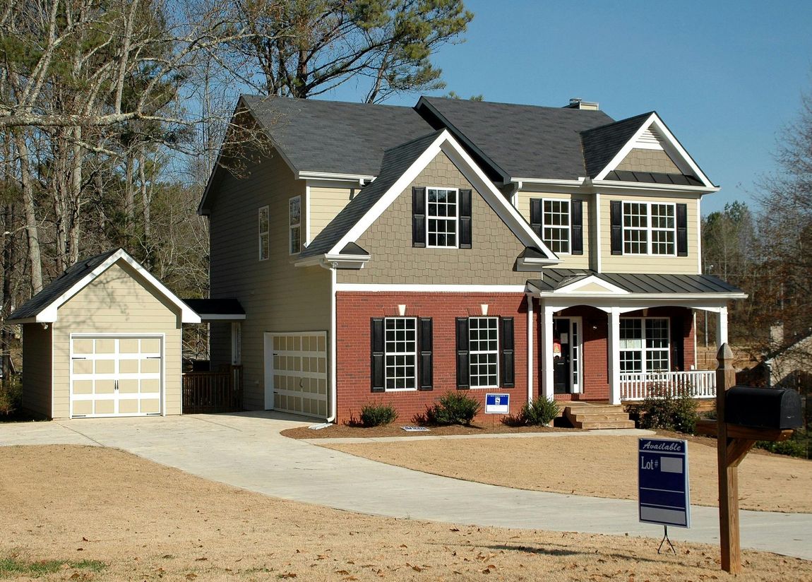 A two-story suburban residential home, representing a property secured by an owner's policy of title insurance.