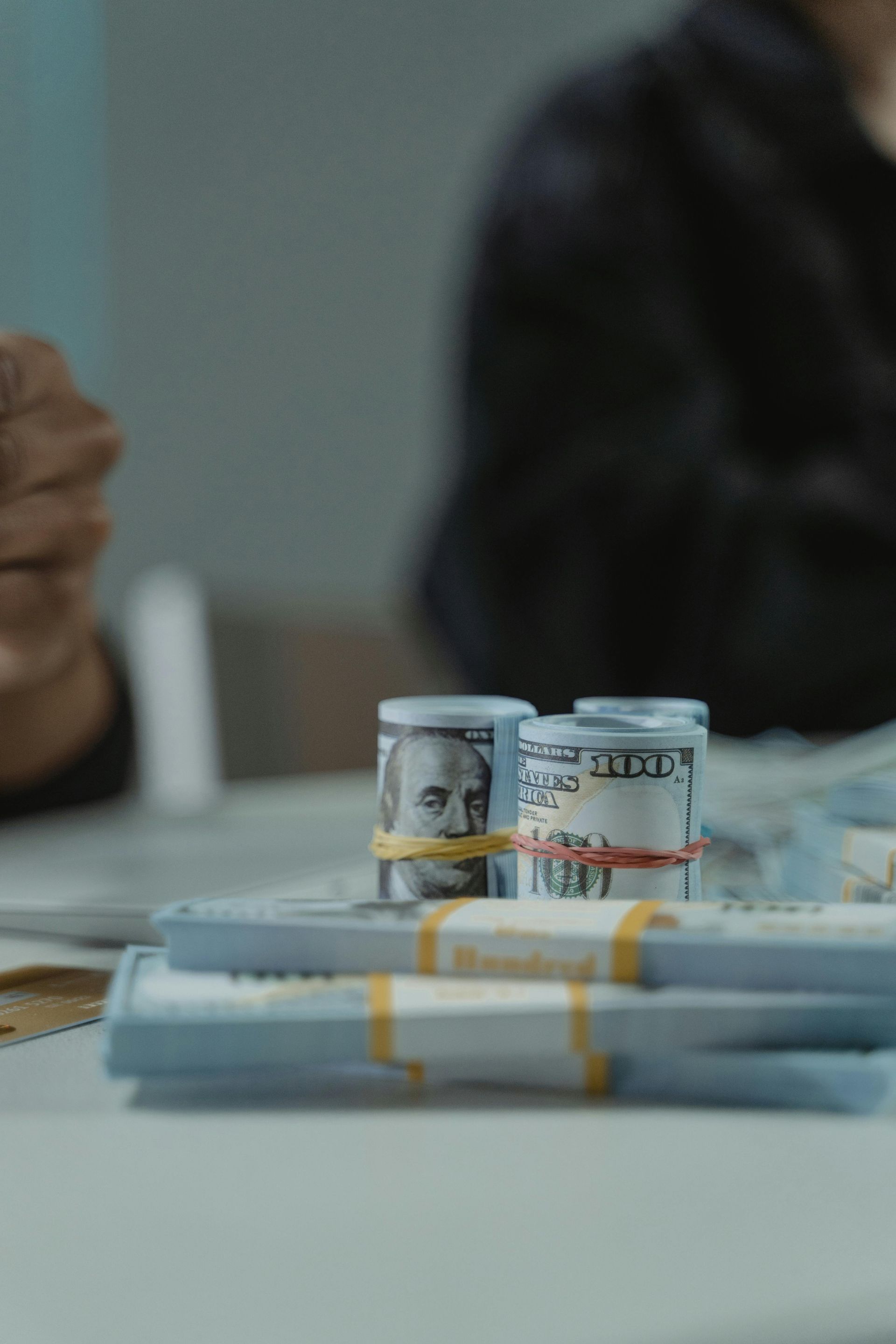 Financial professional counting mortgage funds protected by a comprehensive lender's title insurance policy.