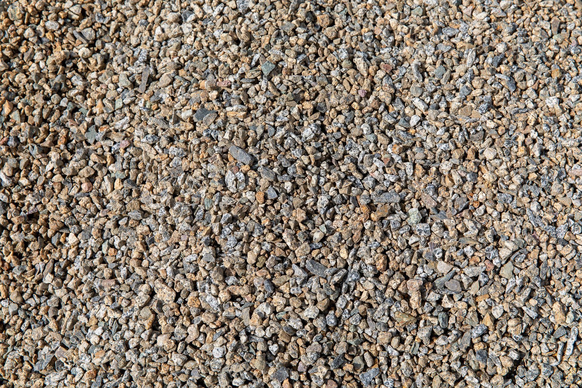 A pile of gravel is sitting on the ground.