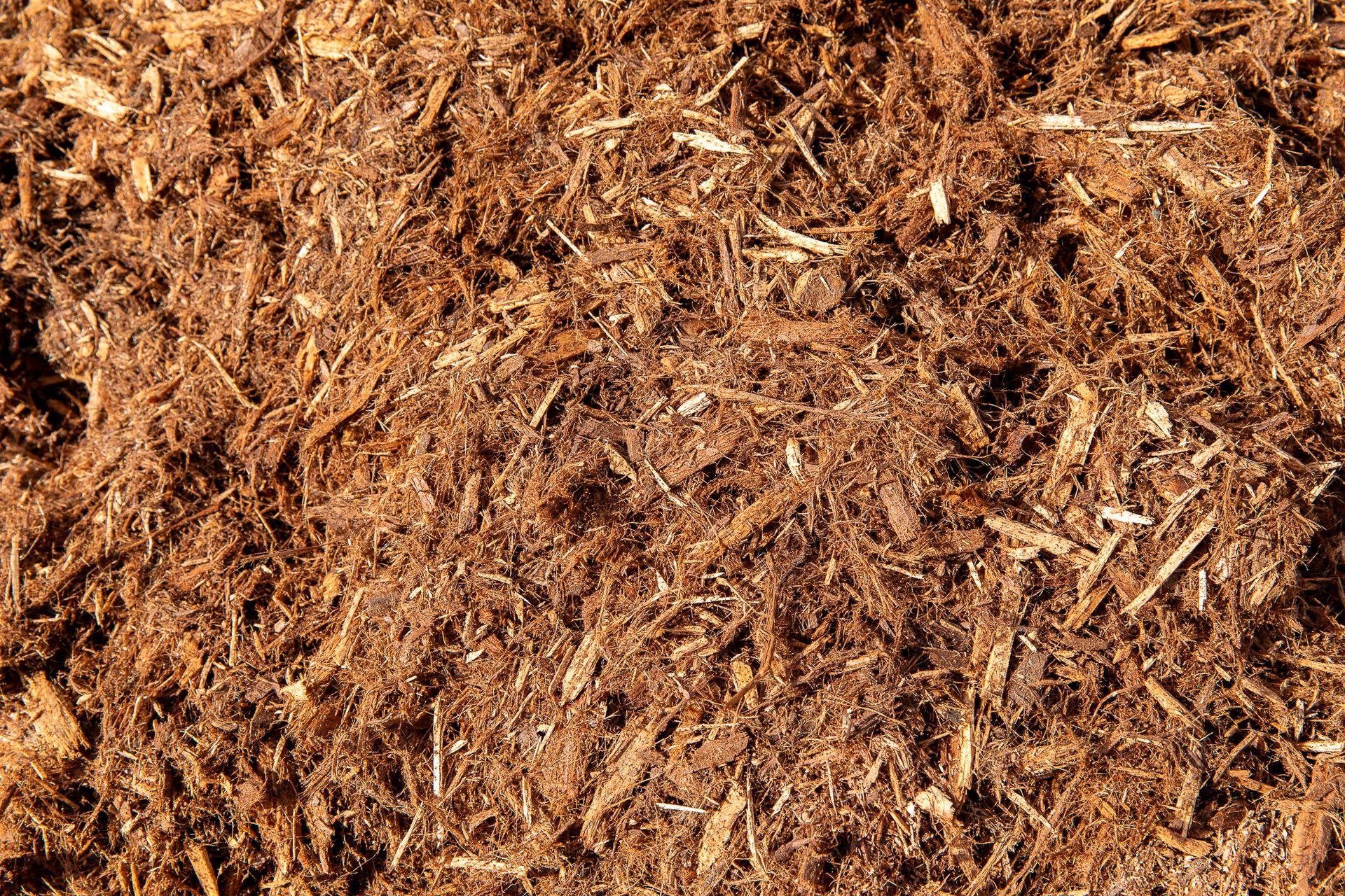 A close up of a pile of brown mulch