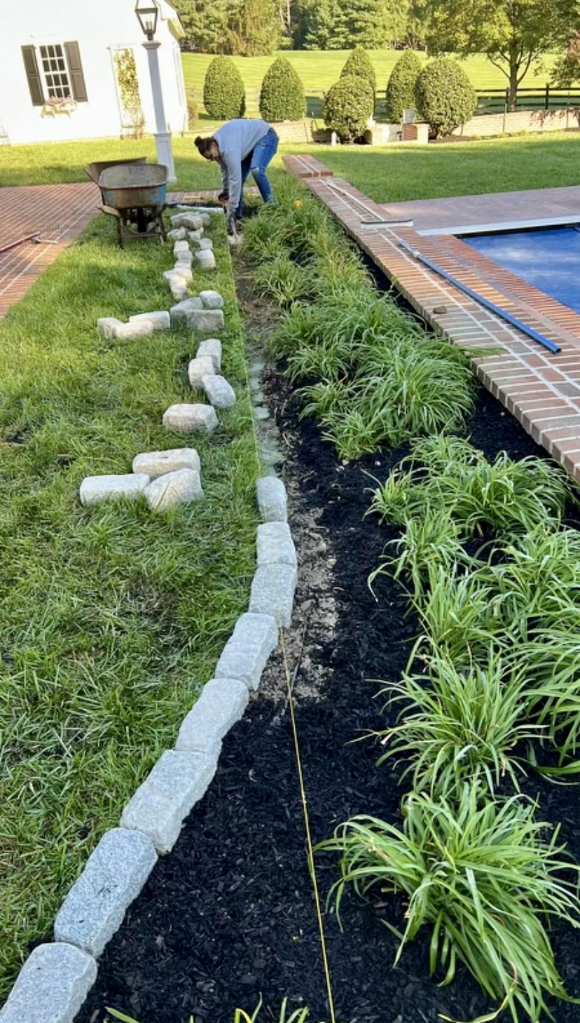 Stone Edging a Garden in Columbia