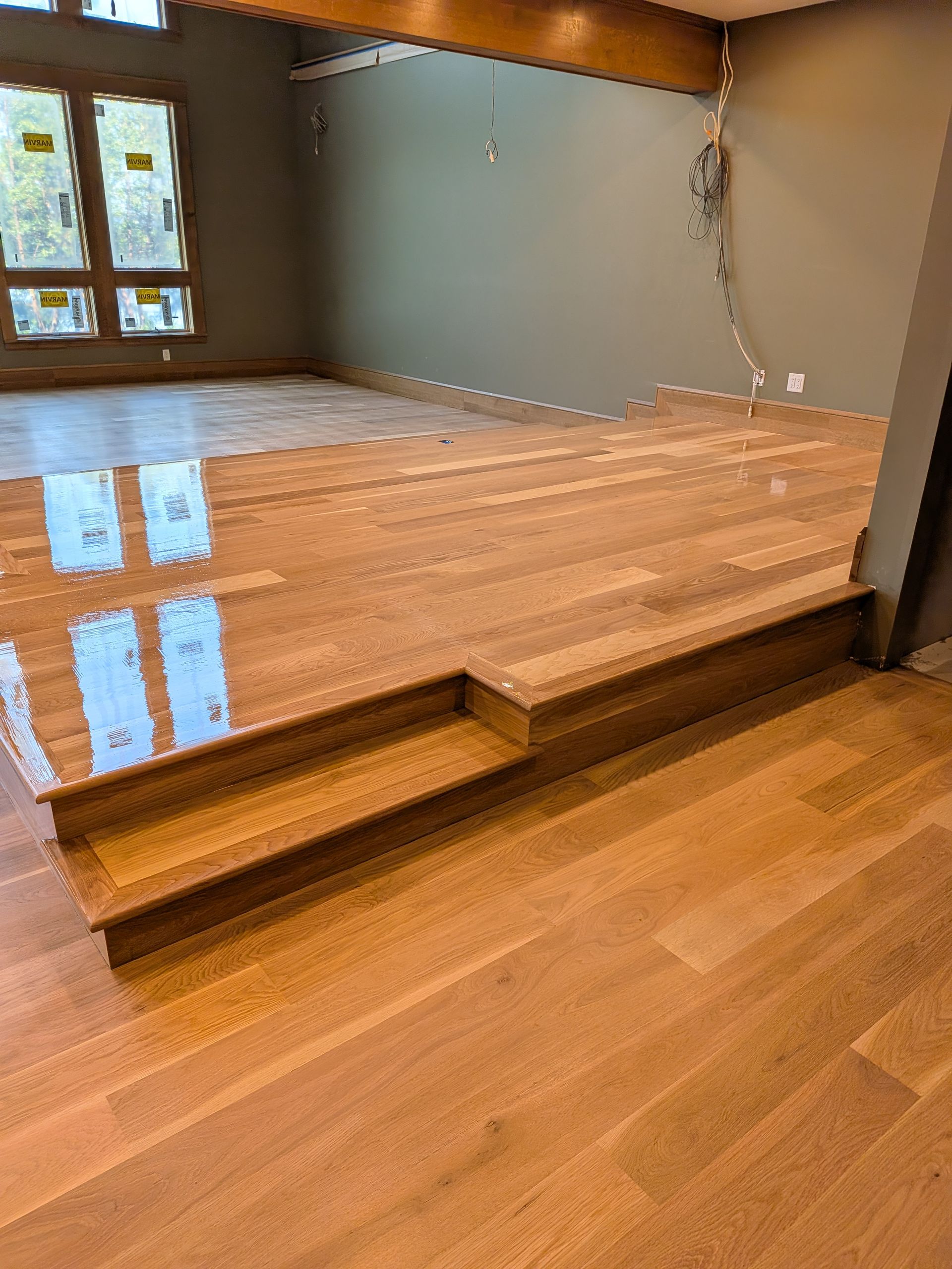 Professionally resurfaced hardwood floor with restored wood grain in a Southern Oregon residence.