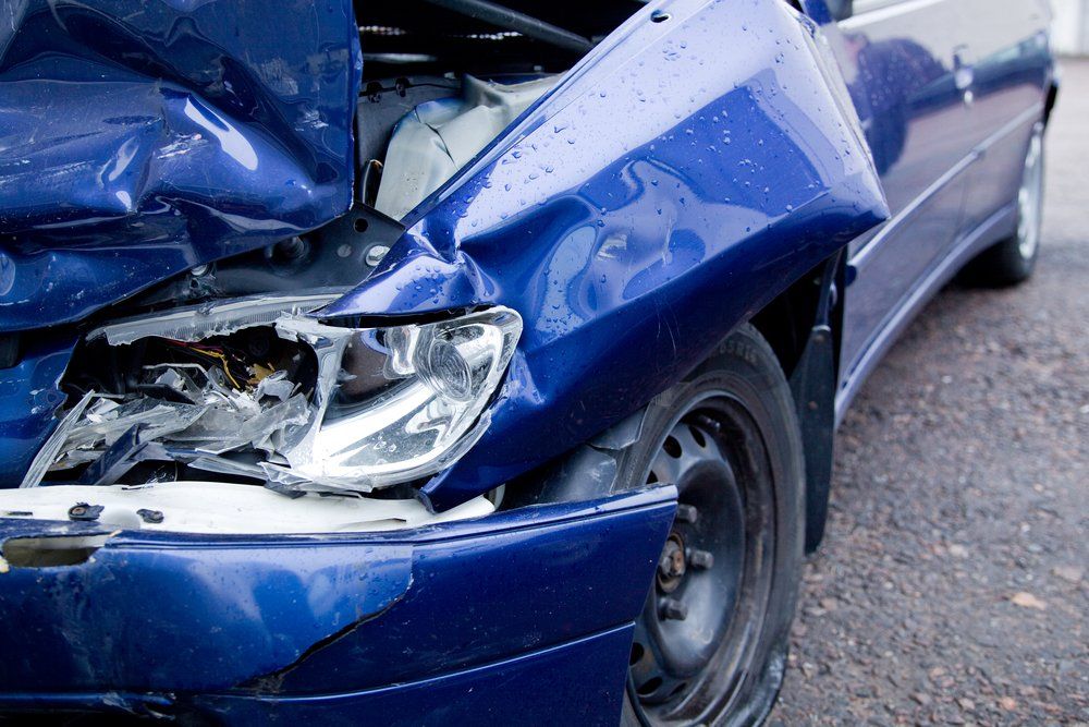 A Blue Car Has Been Damaged in A Car Accident — East Maitland Body Repairs in East Maitland, NSW