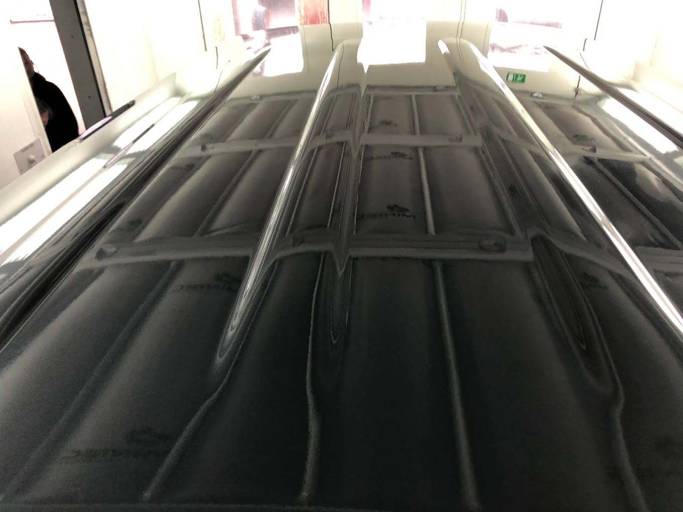 A ceiling with a green exit sign on it — East Maitland Body Repairs in Raymond Terrace, NSW