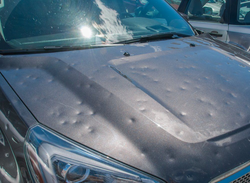 The Hood of A Car Is Covered in Hail — East Maitland Body Repairs in Maitland, NSW