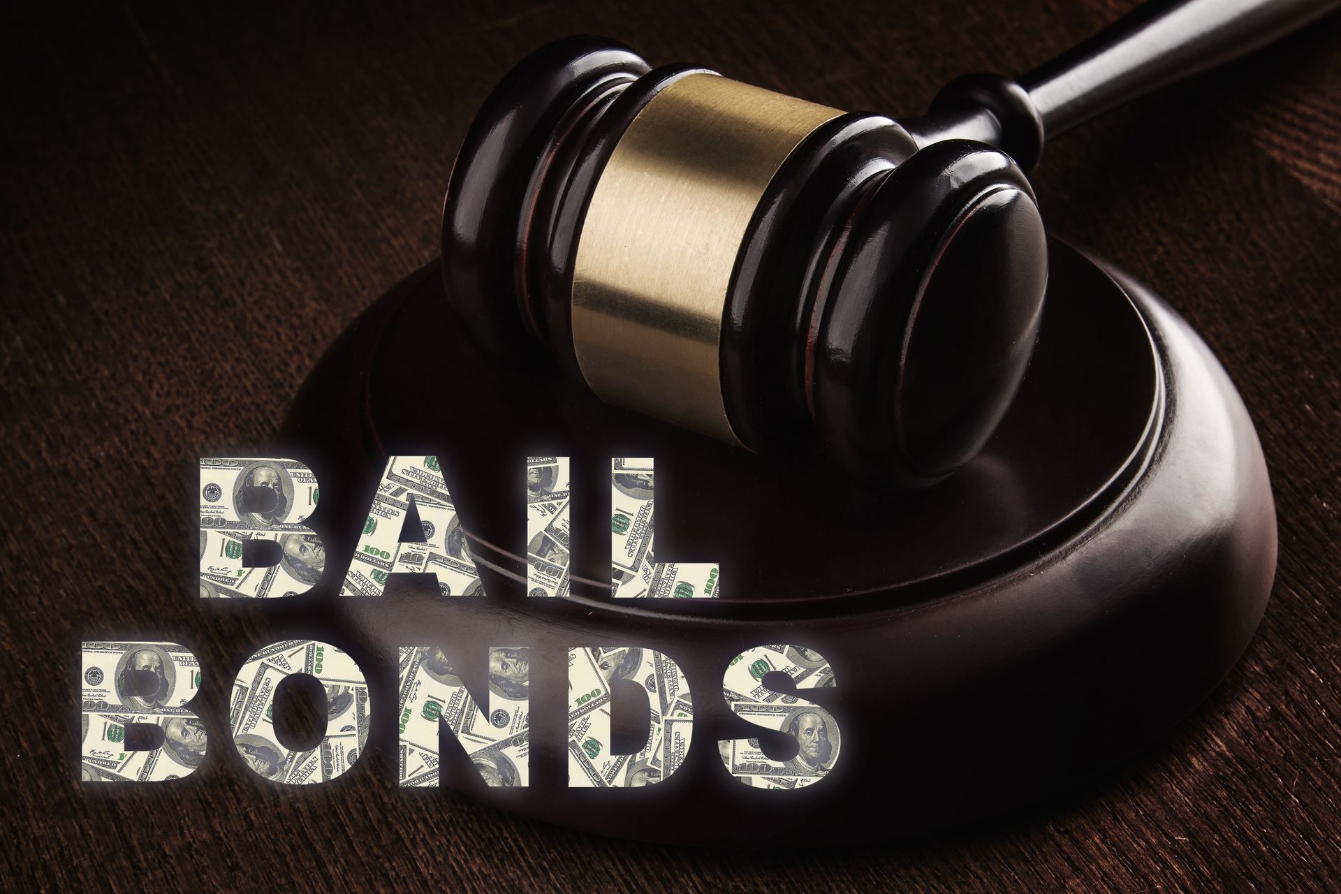 Bail bond services are symbolized by a judge’s gavel resting on a wooden surface.