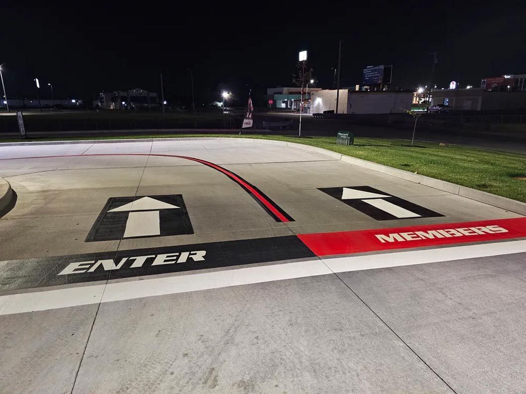 A parking lot with a sign that says enter on it