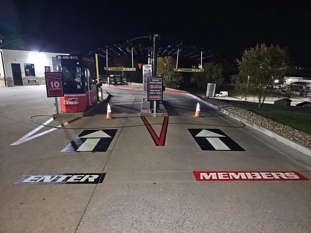 A parking lot with a sign that says members on it.