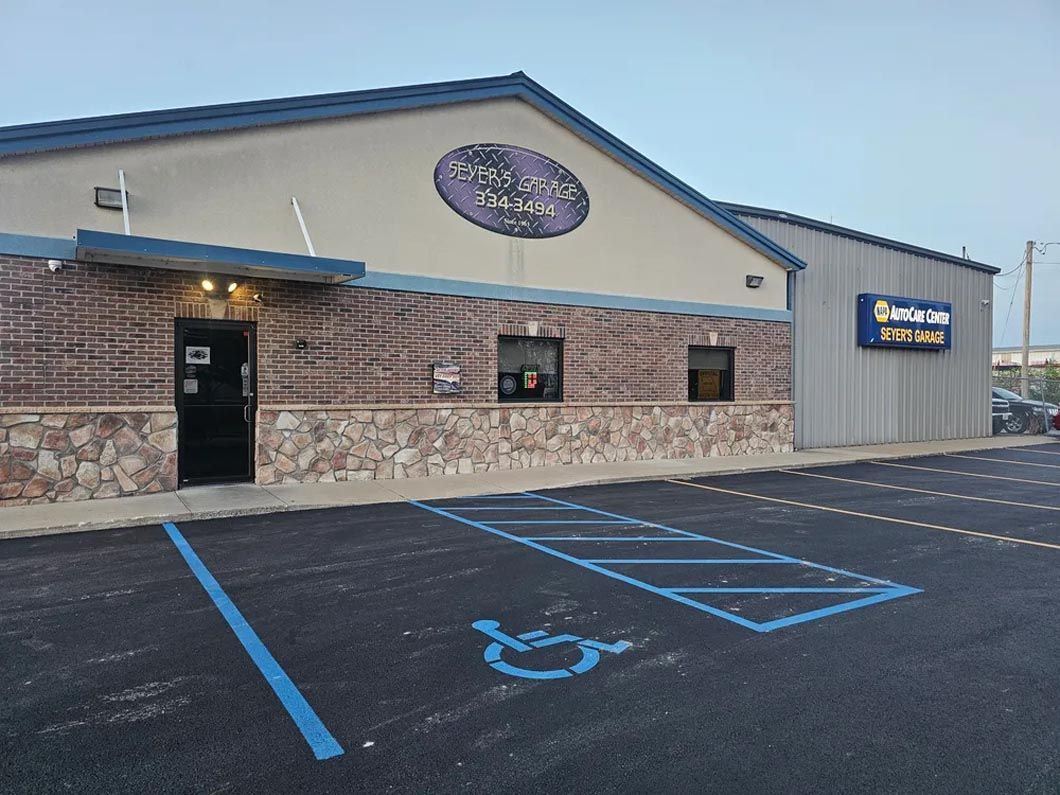 A building with a handicapped parking spot in front of it.