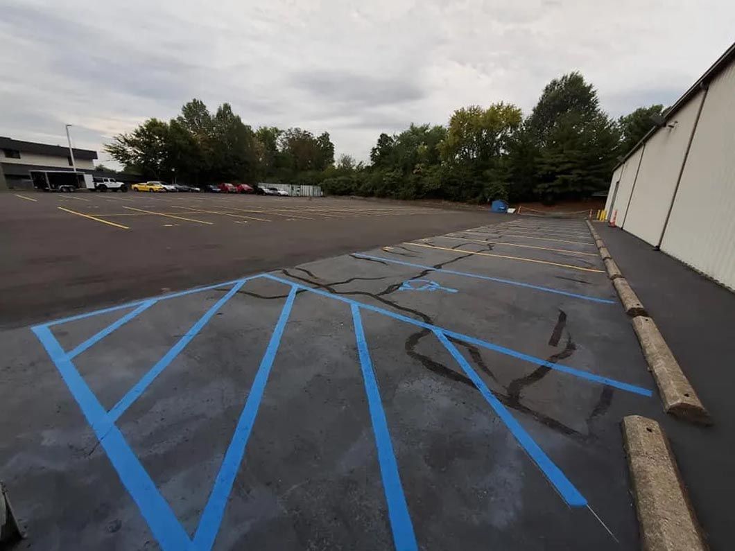 A parking lot with blue lines painted on it