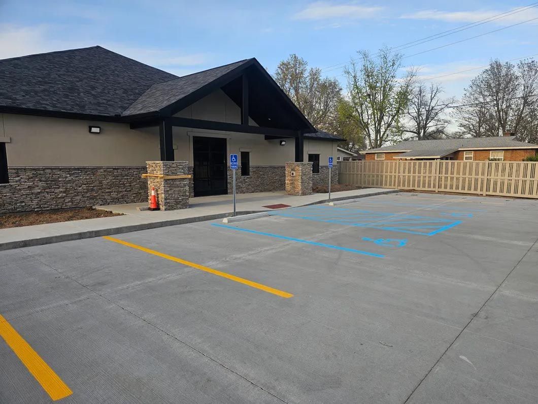 There is a handicapped parking spot in front of a building.
