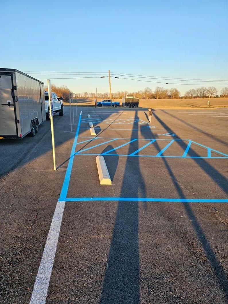 A parking lot with a blue line painted on it.