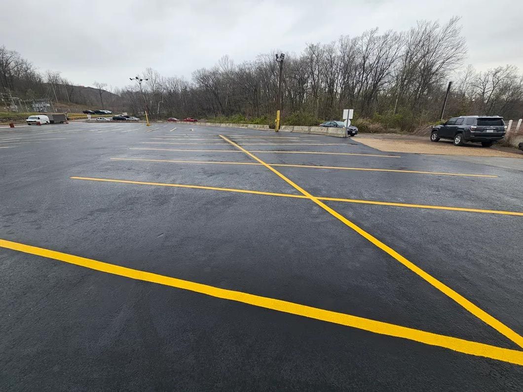A parking lot with a yellow line on the side of it.
