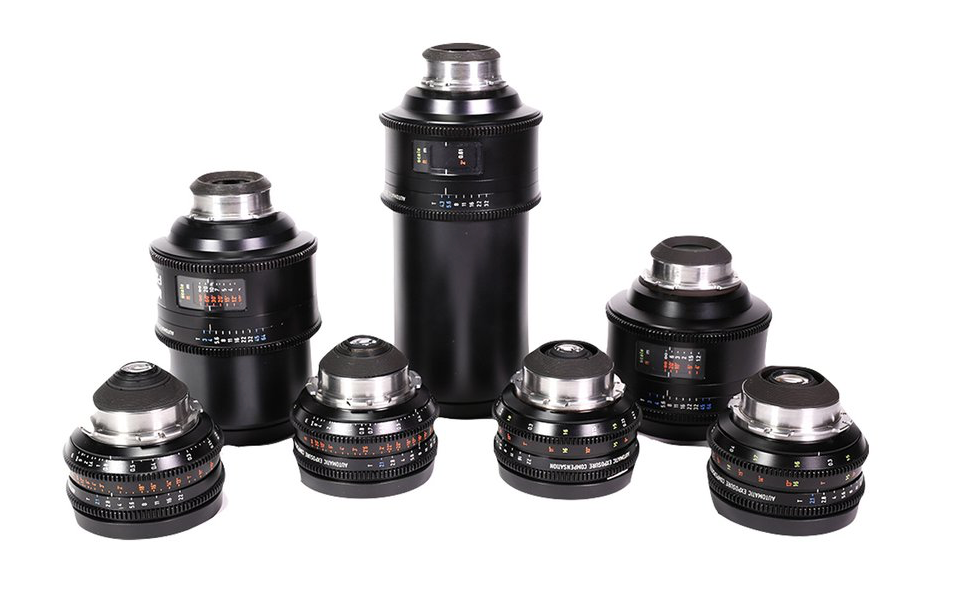 Set of black camera lenses, varying sizes, on white background.